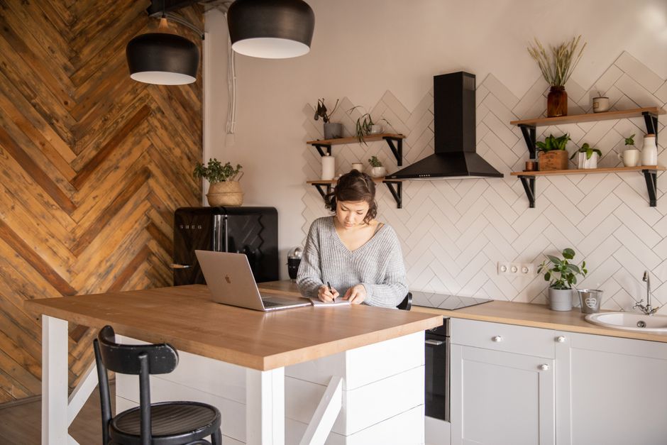 Kitchen interior designer working on structural blueprints
